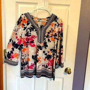 Flowered blouse with beaded detail on neckline and sleeves.